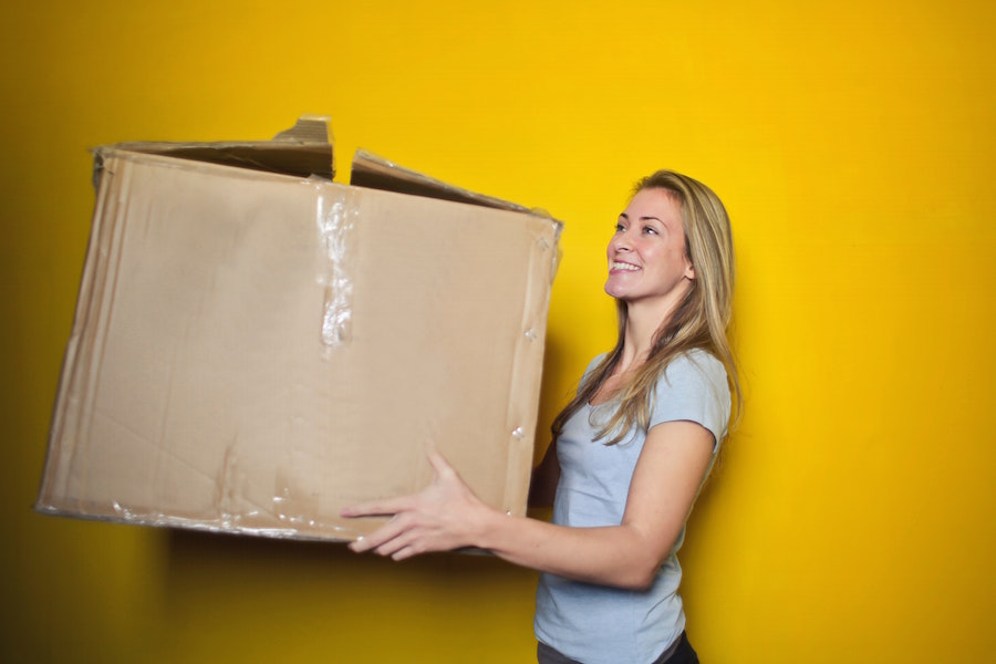 Woman moving box