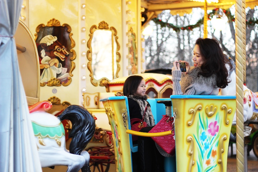 Mother and child on carousel