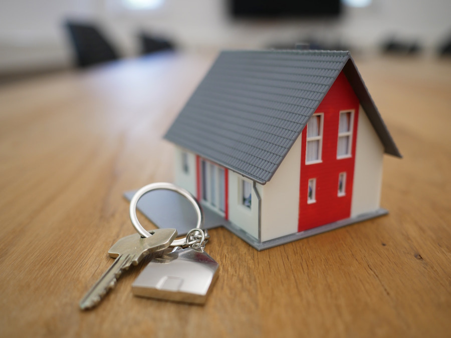 Buy a home figure with keys